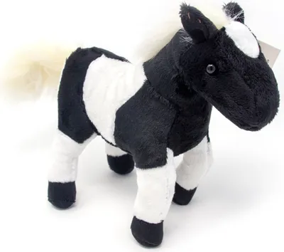A plush toy horse on a white background.