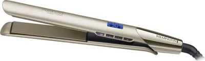 A gold and black Remington hair straightener is shown against a white background.