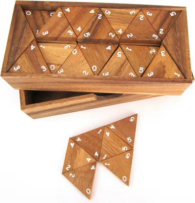 A wooden puzzle game with numbered triangular pieces is shown in a wooden box, with some pieces laid out in front.