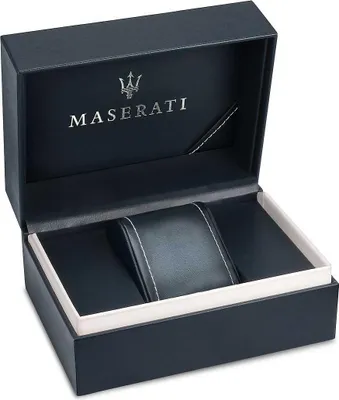 An open Maserati watch box with a black interior and a white trim. The lid of the box has the Maserati logo and name printed on it.