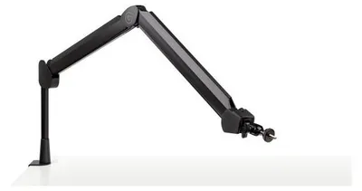 A black adjustable microphone arm is mounted on a white surface.