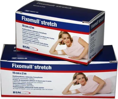 Two boxes of BSN Fixomull stretch medical tape are stacked on top of each other. The boxes feature a woman with her arm resting on her head, and text describing the product.