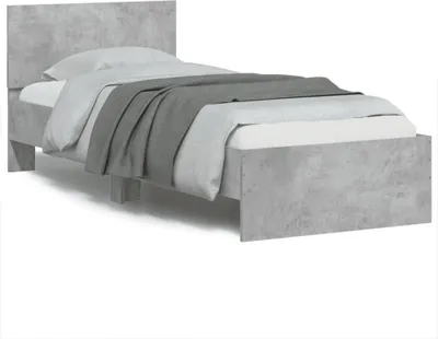 A single bed frame with a headboard, made of wood composite with a concrete-like finish, is shown against a white background. The bed is made up with a white mattress, light gray bedding, and a darker gray blanket draped over it.