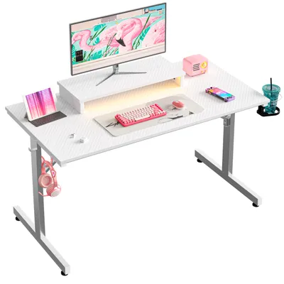 A white gaming desk set up with a monitor, laptop, keyboard, mouse, headphones, and a drink.