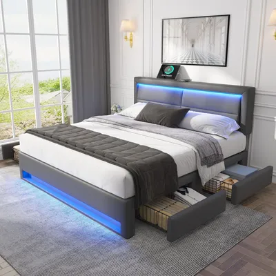 A modern bedroom with a grey upholstered bed frame featuring LED lighting and storage drawers.