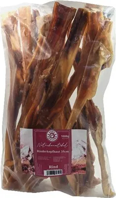 Produktbild von Paul & Paulina Rinderkopfhaut luftgetrocknet 1kg ca. 35cm lang Kausnack für Hunde