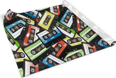 A roll of self-adhesive furniture film with a pattern of colorful cassette tapes.