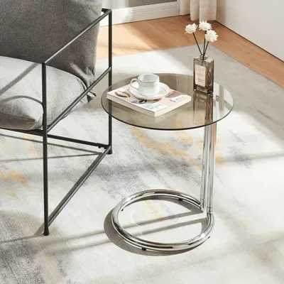 A modern living room setting with a chair and a side table.