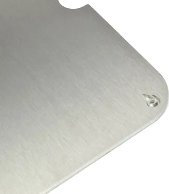 A close-up, angled view of a brushed metal grill plate.