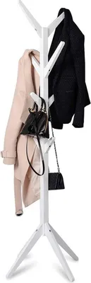 A white coat rack with two coats and two handbags hanging on it.