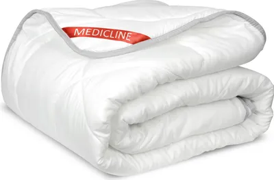 A white Medicline duvet is folded and presented against a white background.