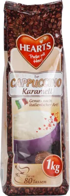 A bag of cappuccino mix with coffee beans in the background.