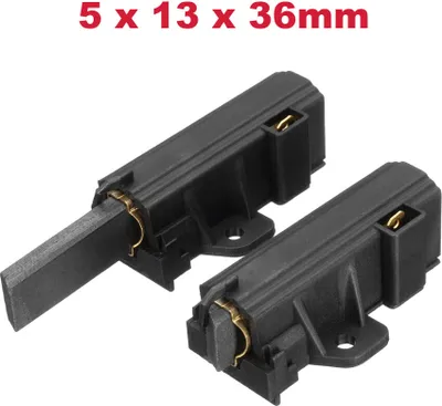 Two black carbon brushes with gold connectors are shown on a white background. Text indicating dimensions is present at the top.