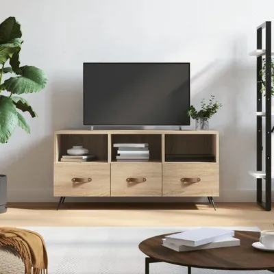 A TV stand with a television on top, placed in a living room setting.