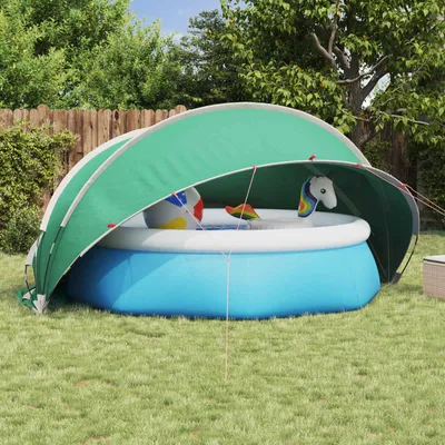 An inflatable pool with a dome cover in a backyard setting.