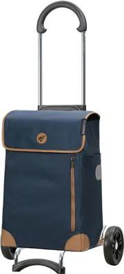 A navy blue shopping trolley with tan trim and a retractable handle, shown against a white background.