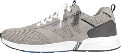 Side view of a gray sneaker.