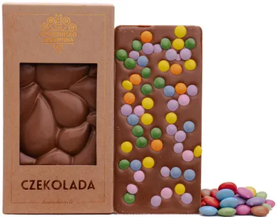 Produktbild von Vollmilchschokolade mit Mini-Linsen 100g - Schronisko Bukowina