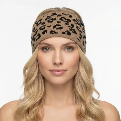 A woman wearing a leopard print headband.