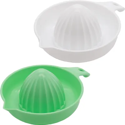 Two manual citrus juicers, one white and one green, are displayed against a white background.