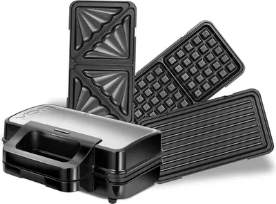 A black multi-functional kitchen appliance with interchangeable plates for making sandwiches, waffles, and grilling.