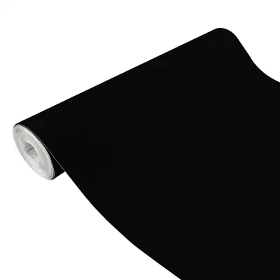 A roll of black velvet fabric is shown diagonally against a white background.