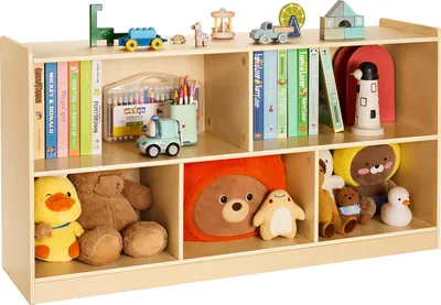 A wooden bookshelf filled with children's books and stuffed toys.