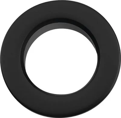 A black ring-shaped object, likely a sink overflow cover, is shown against a white background.
