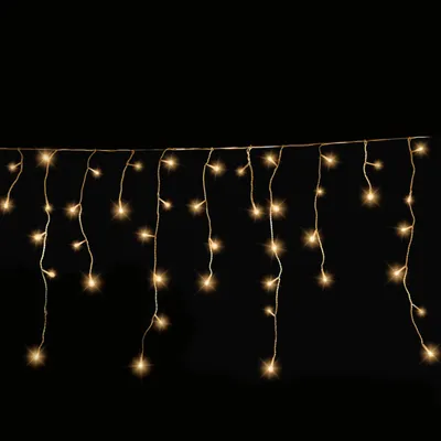 A string of icicle-shaped lights against a black background.