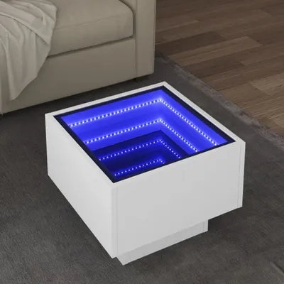 A white square coffee table with a blue LED infinity mirror effect is shown on a gray rug next to a beige sofa.