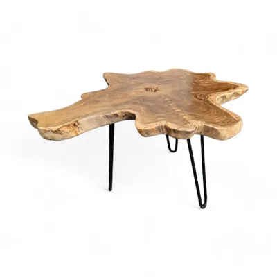 A wooden coffee table with a natural, irregular shape and black metal hairpin legs, shown against a white background.