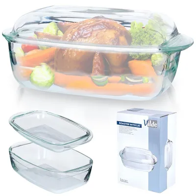 A glass roaster with a chicken and vegetables inside, shown with two empty glass dishes and a product box.