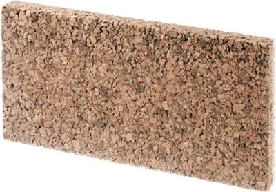 A single rectangular object made of cork material, shown in a studio setting against a white background.
