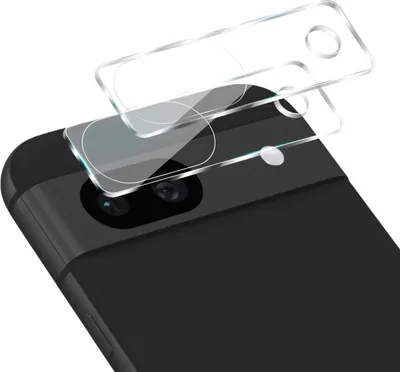 A close-up view of a smartphone's camera lens area with a protective glass cover being applied.