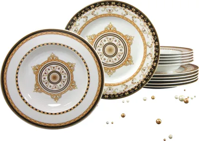 A set of porcelain plates and bowls with intricate gold and black detailing, arranged on a white background.