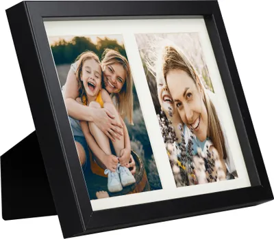 A black multi-photo frame with two photos of women and children.