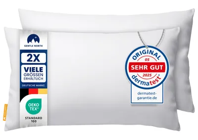 Two white pillows are shown, one slightly behind the other.