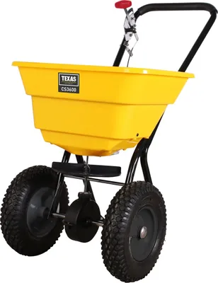 A yellow spreader with black frame and wheels, shown from a front-diagonal angle.