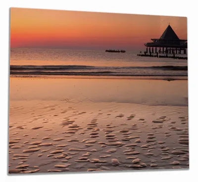Produktbild von Wallario Herdabdeckplatte aus Glas, Größe 60 x 52 cm 1-teilig, Motiv Strand am Abend - Seebrücke am Ostseebad Heringsdorf