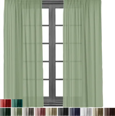 Two light green sheer curtains are shown hanging in front of a dark wooden window frame.