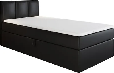 A black boxspring bed with a white mattress and a black headboard, shown from a side angle against a white background.