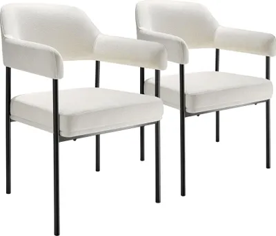 Two upholstered armchairs with black metal legs against a white background.