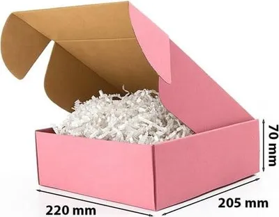 A pink cardboard box with its lid open, filled with white shredded paper.