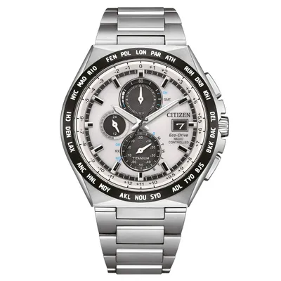 A silver Citizen Eco-Drive radio-controlled analog watch with a white dial and black city codes around the bezel.