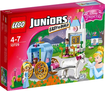 The image shows the LEGO Juniors Cinderella's Fairy Tale Carriage 10729 building set packaging. It features a colorful illustration of the set's components, including Cinderella, her carriage, a horse, and a small castle, set against a festive background w