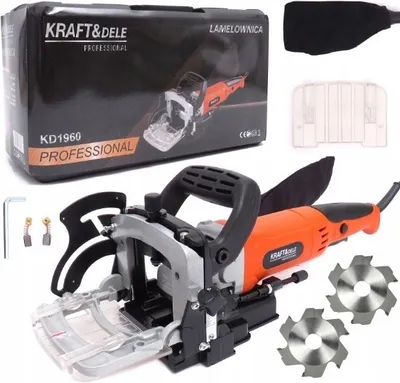 A product shot of an electric hand router and its accessories, laid out on a white background. The product packaging is visible in the top left corner.