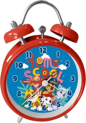 A red analog alarm clock with Paw Patrol characters on the face.