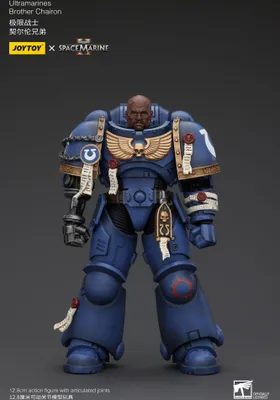 A studio shot of a Warhammer 40,000 Ultramarines Brother Chairon action figure against a dark gray background.