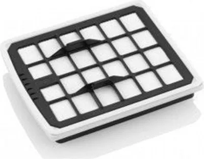 A close-up, angled view of a white and black HEPA filter with a grid pattern.
