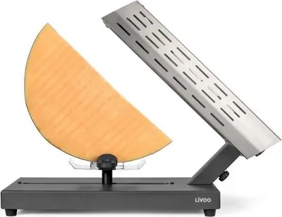 A raclette grill with a wedge of cheese.